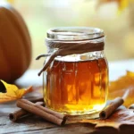 To make your own pumpkin spice syrup, you need a few key ingredients: - 1 cup of pure pumpkin puree - 1 cup of packed brown sugar - 1 cup of water - 1 teaspoon of pure vanilla extract - 1 teaspoon of pumpkin pie spice - A pinch of fine sea salt These ingredients work together to create a thick and rich syrup. The pumpkin puree gives it a wonderful fall flavor. Brown sugar adds sweetness and depth. Water helps mix everything smoothly. Vanilla extract enhances the taste, while pumpkin pie spice brings warmth. Sea salt balances the sweetness. You can also get creative with some optional ingredients: - Additional spices like cinnamon, nutmeg, or ginger - Sweetener alternatives like maple syrup or honey - Flavor variations such as vanilla bean or caramel These add-ins can make your syrup unique. If you love spice, adding more cinnamon or nutmeg will give it a kick. Want a different kind of sweetness? Try maple syrup or honey instead of brown sugar. You can even mix in vanilla bean for an extra touch! For the full recipe, check out the detailed steps and tips to make your pumpkin spice syrup shine! To make your pumpkin spice syrup, you need to start with the right items. Gather these ingredients: - 1 cup of pure pumpkin puree - 1 cup of packed brown sugar - 1 cup of water - 1 teaspoon of pure vanilla extract - 1 teaspoon of pumpkin pie spice - A pinch of fine sea salt Also, grab your tools: - A medium saucepan - A whisk or wooden spoon - A fine mesh sieve - A clean glass jar or bottle Now, let’s cook! Combine the pumpkin puree, brown sugar, and water in the saucepan. Place it over medium heat. Stir non-stop to dissolve the sugar. You want a smooth mix. Next, add the vanilla extract, pumpkin pie spice, and sea salt. Stir again to mix all the flavors together. Increase the heat a bit until the mix starts to simmer. Then, lower the heat and let it cook for 10-15 minutes. This helps thicken the syrup and blend the spices. When the syrup is thick enough, take the pan off the heat. Let it cool for a few minutes. Now, we need to strain the syrup. Set the fine mesh sieve over your jar or bottle. Pour the syrup through, pressing the solids with a spoon. This helps you get every drop. Discard what’s left in the sieve. Let the strained syrup cool completely. Once it’s cool, seal your jar or bottle. Store it in the fridge. It will stay fresh for up to two weeks. You’ll know it’s ready to store when it’s thick and smooth. Enjoy your homemade pumpkin spice syrup! For the full recipe, check the link. To get the right thickness, you need to simmer your syrup. Let it cook for 10 to 15 minutes. Keep stirring to avoid burning. If it seems too thin, let it cook longer. Check the consistency by letting it cool a bit. It will thicken more as it cools. Balancing flavors is key. Use fresh spices for the best taste. If you love cinnamon, add a little more. A pinch of nutmeg can enhance the flavor. Don’t forget the sea salt; it brings out the sweetness. This syrup shines with pancakes and desserts. Drizzle it over warm pancakes, waffles, or French toast. It’s also great on vanilla ice cream for a tasty treat. You can even use it in beverages. Stir it into hot coffee, tea, or lattes for a fall delight. Make your syrup look special when serving. Use a clear jar to show off that rich color. For a fun touch, add a cinnamon stick to the jar. This makes it perfect for gifts. Decorative jars add charm and make any kitchen feel cozy. {{image_4}} You can change the flavor of your pumpkin spice syrup with different spices. Instead of just pumpkin pie spice, try adding more cinnamon, nutmeg, or ginger. Want it spiced or mild? Adjust the amount of these spices. If you like a kick, add more cinnamon. For a lighter taste, cut back on the spices. Experiment until you find your favorite blend. You can swap out brown sugar for healthier sweeteners. Maple syrup or honey works well if you prefer those. You can also use stevia or agave syrup for a low-calorie option. When using other sweeteners, taste as you go. Adjust the sweetness to your liking. Remember, not all sweeteners are the same, so start small and build up. If you're vegan, use maple syrup instead of brown sugar. This keeps your syrup plant-based and tasty. For gluten-free options, ensure your sweeteners are certified gluten-free. Most sweeteners are, but always check the labels. These adjustments let everyone enjoy the syrup without worry. You can personalize this recipe to fit your needs and taste. To keep your homemade pumpkin spice syrup fresh, use a clean glass jar. A mason jar works great. Make sure the jar has a tight lid. This will help keep air out. Store the jar in the fridge for best results. Avoid plastic containers, as they can change the syrup’s flavor. To keep your syrup fresh longer, always use a clean spoon when serving. This avoids adding extra bacteria that can spoil the syrup. Your homemade syrup lasts about two weeks in the fridge. If you want to store it longer, freezing is a good choice. Transfer the syrup into an ice cube tray. Once frozen, pop the cubes into a freezer bag. This way, you can use small amounts as needed. You can also freeze it in a jar, but leave space at the top. The syrup will expand when frozen. It stays good for about three months in the freezer. Check your syrup before using it. If you see mold, toss it out. If it smells off or has an unusual color, it’s time to get rid of it. To dispose of spoiled syrup, pour it down the sink and rinse the jar well. This keeps your kitchen clean and safe. Enjoy your pumpkin spice syrup while it’s fresh! Can I use fresh pumpkin instead of puree? Yes, you can use fresh pumpkin. Just cook it until soft, then blend it smooth. This adds a nice texture and flavor. However, using canned pumpkin puree saves time and has a consistent taste. How do I thicken my syrup if it's too runny? If your syrup is too runny, simmer it longer on low heat. This helps reduce the liquid and thickens the syrup. Stir often to avoid burning. You can also add a bit more pumpkin puree to help with thickness. Can I double the recipe? Yes, you can double the recipe. Just make sure your pot is big enough. Keep an eye on the cooking time. It may take a bit longer to thicken. What are the best uses for pumpkin spice syrup? You can use pumpkin spice syrup in many ways. It’s great in coffee, lattes, or hot chocolate. Drizzle it over pancakes or waffles for a sweet treat. You can also mix it into yogurt or oatmeal for breakfast. Can I use it in baking? Yes, you can use the syrup in baking! Add it to muffins, cakes, or cookies. It gives a warm spice flavor that fits perfectly with fall treats. Caloric content per serving Each tablespoon of this syrup has about 50 calories. The total calories depend on how much you use. Nutritional benefits of ingredients used Pumpkin puree is rich in vitamins A and C. It also has fiber, which is good for digestion. Brown sugar adds minerals like calcium and potassium. Plus, the spices can have health benefits like anti-inflammatory properties. Enjoy this tasty syrup for both flavor and nutrition! You've now learned how to make a delicious homemade pumpkin spice syrup. We covered essential ingredients, step-by-step instructions, and storage tips. You also explored fun variations and serving suggestions. Creating this syrup lets you customize flavors and adjust sweetness. Enjoy your treats topped with this fall favorite. The possibilities are endless, so get creative in the kitchen and make it your own! Happy cooking!