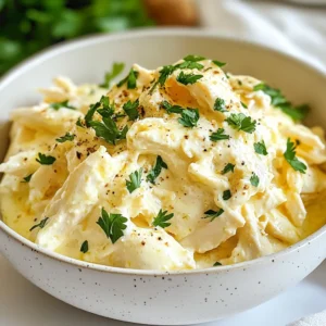 - 4 boneless, skinless chicken breasts - 1 cup heavy cream - 1 cup grated Parmesan cheese - 6 cloves garlic, finely minced - 1 teaspoon Italian seasoning - 1 teaspoon garlic powder - Salt and freshly ground black pepper, to taste Chicken is the star of this dish. I prefer boneless, skinless breasts for easy cooking. They soak up the sauce well. Heavy cream adds richness and smoothness. The Parmesan cheese gives a salty and nutty flavor. Garlic makes everything better! Italian seasoning adds extra depth to the taste. Seasoning with salt and pepper enhances all the flavors. - 1 cup chicken broth - 2 tablespoons olive oil Chicken broth adds moisture and flavor. It helps keep the chicken tender. I use olive oil to sear the chicken. It gives a nice golden crust. - Fresh parsley, finely chopped (for garnish) - Optional toppings like extra Parmesan cheese Fresh parsley brightens the dish. It adds a pop of green and freshness. You can sprinkle extra Parmesan on top for a cheesy touch. This makes the dish look fancy and appetizing. {{ingredient_image_2}} - Preparing the Chicken Start with four boneless, skinless chicken breasts. Rinse them under cool water and pat them dry. This helps the seasonings stick better. Season both sides with salt, pepper, garlic powder, and Italian seasoning. - Cooking in the Skillet In a large skillet, heat two tablespoons of olive oil over medium heat. Once hot, place the chicken breasts in the skillet. Cook for about 3-4 minutes on each side. You want a nice golden-brown crust. This step adds flavor and makes the chicken juicy. After searing, remove the chicken and set it aside on a plate. - Combining Ingredients In a mixing bowl, whisk together one cup of chicken broth, one cup of heavy cream, six cloves of minced garlic, and one cup of grated Parmesan cheese. Make sure everything blends well. This will be your delicious sauce that makes the chicken creamy and rich. - Ensuring Smoothness Check the mixture for any lumps. It should be smooth and creamy. If needed, whisk again until you get the right texture. A smooth sauce ensures every bite is packed with flavor. - Layering Chicken and Sauce Place the seared chicken breasts in the crockpot in a single layer. Pour the creamy garlic sauce over the chicken. Ensure each piece is well-coated. This helps the chicken absorb all the flavors while cooking. - Setting Cooking Time Cover the crockpot with its lid. Set it to cook on low for 6-7 hours or on high for 3-4 hours. Check the chicken at the end of the cooking time. It should be tender and cooked through. This slow cooking makes the chicken so soft and flavorful. - Shredding Technique Once the cooking time is up, use two forks to shred the chicken inside the crockpot. This makes it easier to mix with the sauce. The chicken should fall apart easily. Stir the shredded chicken in the sauce to coat it well. - Serving Suggestions Serve the creamy garlic Parmesan chicken over rice, pasta, or alongside steamed veggies. For a nice touch, garnish with freshly chopped parsley and a sprinkle of extra Parmesan. This adds color and a fresh flavor to your dish. Enjoy your meal! Achieving Golden-Brown Chicken To get that nice golden color, heat olive oil on medium. Season your chicken with salt, pepper, garlic powder, and Italian seasoning. Once the oil is hot, add the chicken. Sear it for about 3-4 minutes on each side. This step adds flavor and texture. Seasoning Tips Don’t be shy with the seasonings! Generous amounts of salt and pepper work wonders. Garlic powder and Italian seasoning add depth. You’ll notice the difference in every bite. Adjusting for Different Heat Settings Cooking times vary with heat settings. On low, expect to cook for 6-7 hours. If you’re in a hurry, use high for 3-4 hours. Always check that the chicken is fully cooked before serving. Tips for Tender Chicken For the best texture, don’t rush the cooking. Cooking on low allows the chicken to soak up flavors. If you find your chicken is tough, it may need more time. Additional Seasonings Want to spice things up? Try adding red pepper flakes for heat. Herbs like thyme or rosemary can also enhance the dish. Mix and match to create your own twist! Pairing Suggestions This creamy dish pairs well with rice, pasta, or vegetables. Serve it over steamed broccoli or nestled next to mashed potatoes. Each option adds a nice balance to the meal. Pro Tips Perfectly Sear the Chicken: Make sure your skillet is hot enough before adding the chicken. A good sear will lock in juices and enhance flavor. Use Fresh Garlic: For the best flavor, use fresh garlic instead of pre-minced. It adds a vibrant taste to the dish. Adjust Consistency: If the sauce is too thick after cooking, you can thin it out with a little more chicken broth or cream to reach your desired consistency. Meal Prep Ready: This dish is perfect for meal prep! It reheats well and can be served with various sides throughout the week. {{image_4}} Healthier Options You can make this dish lighter by using chicken thighs instead of breasts. They have more flavor and stay juicy. For a lower-calorie sauce, swap heavy cream for Greek yogurt. This will still give you creaminess without the extra fat. Dairy-Free Alternatives If you want a dairy-free version, replace heavy cream with coconut milk. Use nutritional yeast instead of Parmesan cheese for a cheesy flavor. This keeps your meal creamy and delicious without dairy. Instant Pot Instructions To cook this in an Instant Pot, sear the chicken first in the pot. Then, mix the sauce ingredients as you would for the crockpot. Add the chicken and sauce, seal the lid, and cook on high pressure for 10 minutes. Quick release the pressure, shred the chicken, and mix it with the sauce. Oven-Baked Version For an oven-baked version, sear the chicken in a skillet. Then, place it in a baking dish. Pour the sauce over the chicken and cover it with foil. Bake at 375°F for about 30-35 minutes. This gives a nice baked texture while keeping it moist. Adding Vegetables You can easily add vegetables to this dish. Try adding spinach or sun-dried tomatoes for extra flavor. Bell peppers or mushrooms also work well. Just toss them in the crockpot with the chicken and sauce. Spicy Versions Want some heat? Add red pepper flakes or diced jalapeños to the sauce. This will give your dish a nice kick. You can adjust the spice level based on your taste. Enjoy the creamy and spicy mix! To store leftovers, let the chicken cool first. Place it in an airtight container. This keeps it fresh for later meals. You can refrigerate it for 3-4 days. Make sure to check for any signs of spoilage before eating. To freeze this creamy chicken, let it cool completely. Place it in a freezer-safe bag or container. Squeeze out excess air to prevent freezer burn. It stays good for up to three months. For thawing, move it to the fridge overnight. This keeps the chicken safe and tasty. You can also use the microwave. Just be sure to use the defrost setting. You can reheat in the microwave or on the stovetop. For the microwave, put it in a safe dish. Heat it in short bursts, stirring in between. For stovetop, warm it in a pan over low heat. Add a splash of cream if it looks thick. This keeps the dish creamy and delicious. Enjoy your meal again! Yes, you can use frozen chicken breasts in this recipe. When using frozen chicken, you need to adjust the cooking time. Cook it on high for about 5-6 hours. The chicken will stay juicy and tender. Just ensure the chicken reaches a safe internal temperature of 165°F. If you want a lighter option, try using half-and-half instead of heavy cream. You can also mix milk with a little cornstarch. Use a ratio of 1 cup of milk with 2 tablespoons of cornstarch. This will help mimic the creaminess you want. To thicken the sauce, you can add a cornstarch slurry. Mix 1 tablespoon of cornstarch with 2 tablespoons of cold water. Stir this into the sauce about 30 minutes before the cooking ends. Alternatively, you can let the sauce cook longer with the lid off to reduce it. Yes, this dish can be gluten-free. Just ensure your chicken broth and any added seasonings do not contain gluten. Most chicken broths are gluten-free, but it’s best to check the label. Enjoy this creamy delight without any worries! This blog post gave you a clear path to a creamy chicken dish. We covered key ingredients, step-by-step cooking methods, and storage tips. You now know how to achieve the perfect sear and can even try different cooking styles. Remember, you can modify flavors and ingredients to fit your taste. This dish is both flexible and delicious, making it a great choice for meals. Enjoy your cooking, and don’t shy away from experimenting to make it your own!