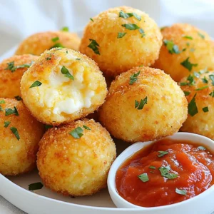 - 2 cups cooked Arborio rice (cooled to room temperature) - 1 cup fresh mozzarella cheese, cut into small cubes - 1/2 cup finely grated Parmesan cheese - 1/2 cup plain breadcrumbs (plus extra for coating) - 1/4 cup fresh parsley, chopped finely - 2 large eggs, beaten gently - 1 teaspoon garlic powder - 1 teaspoon onion powder - 1/2 teaspoon fine salt - 1/4 teaspoon freshly cracked black pepper - 1 cup marinara sauce (for serving) - Olive oil spray (for baking) When making arancini, the key ingredient is Arborio rice. This rice is creamy and sticky, making it perfect for shaping. The mozzarella adds a melty surprise inside, while the Parmesan gives a rich flavor. You also need fresh parsley to brighten the dish. For seasoning, I use garlic powder and onion powder. These add depth without overpowering the other flavors. Salt and pepper are must-haves too. The breadcrumbs help give a crispy shell. When you roll the arancini in breadcrumbs, they bake up golden and crunchy. The eggs bind everything together, ensuring your arancini hold their shape. Lastly, don't forget the marinara sauce! It pairs perfectly for dipping. Enjoy making this dish with these simple yet important ingredients. {{ingredient_image_2}} - Preheat your oven to 400°F (200°C). - Line your baking sheet with parchment paper. This helps the arancini not stick. In a large bowl, combine the following: - 2 cups cooked Arborio rice (make sure it's cool) - 1 cup fresh mozzarella cheese, cut into small cubes - 1/2 cup finely grated Parmesan cheese - 1/2 cup plain breadcrumbs - 1/4 cup fresh parsley, chopped finely - 2 large eggs, beaten gently - 1 teaspoon garlic powder - 1 teaspoon onion powder - 1/2 teaspoon fine salt - 1/4 teaspoon freshly cracked black pepper Mix everything together. Use your hands or a spatula. You want all the ingredients to blend well. Now, take about 2 tablespoons of the rice mixture. Flatten it in your palm. - Place a cube of mozzarella in the center. - Carefully mold the rice around the cheese. Make a smooth ball. - Ensure the cheese is fully enclosed. Repeat this to create about 12 arancini. Next, roll each ball in extra breadcrumbs. This makes a nice crispy coating when baked. Arrange the coated arancini on the prepared baking sheet. Leave some space between each one. - Spray each arancini with olive oil. This helps them get golden brown. - Bake in the oven for 25-30 minutes. Look for a golden color and crisp outside. Check halfway to turn them for even cooking. Once done, take them out and let them cool a bit. Enjoy them warm with marinara sauce on the side for dipping! - Ensuring cheese is well-enclosed: When you form the arancini, place the cheese cube in the center. Mold the rice around it tightly. This step is key. If the cheese is not fully covered, it may leak out while baking. No one wants a cheesy mess! - The importance of spacing on the baking sheet: Space the arancini well on the baking sheet. This allows hot air to circulate. If they are too close, they might stick together. They need room to become golden and crispy. - Best sauces for dipping: Marinara sauce is a classic choice. Its rich flavor pairs well with the cheesy arancini. You could also try ranch, garlic aioli, or spicy marinara for extra zing. - Creative plating ideas for serving: Serve arancini on a rustic wooden platter. Add fresh basil or parsley leaves around them for color. Place a small bowl of marinara in the center. This makes for a lovely and inviting display. Pro Tips Use Cold Rice: Ensure the Arborio rice is completely cooled before mixing. This helps the arancini hold their shape better during frying or baking. Experiment with Fillings: Feel free to add other fillings like cooked mushrooms, spinach, or different cheeses for a unique twist on traditional arancini. Don’t Skip the Breadcrumbs: The extra layer of breadcrumbs is crucial for a crispy texture. Make sure to coat each ball thoroughly. Serve with Fresh Herbs: Garnish your arancini with fresh parsley or basil before serving for an extra pop of flavor and color. {{image_4}} You can switch the cheese to change the flavor. Fontina offers a creamy taste. Cheddar adds a sharp bite. You can mix them or use just one. Try different cheeses to find your favorite. You can add vegetables like spinach or mushrooms. These not only add flavor but also nutrition. For protein, consider adding cooked chicken or sausage. Dice them small and mix into the rice. These additions make your arancini even more filling. If you need a gluten-free option, you can use almond flour instead of breadcrumbs. Cornmeal is another choice that works well. Both options help keep the crispy texture. Make sure to check your ingredients to stay safe. To keep your leftover arancini fresh, use airtight containers. Place the cooled arancini in the container. Make sure they are not stacked on top of each other. This helps to keep them from becoming soggy. Store them in the fridge if you plan to eat them within three days. If you want to save them longer, freezing is a great option. To freeze arancini, let them cool completely first. Place them in a single layer on a baking sheet. Put the baking sheet in the freezer until they are firm. This takes about one to two hours. After they are firm, transfer them to freezer-safe bags. This helps save space and keeps them fresh. When you want to reheat, you can bake them straight from the freezer. Preheat your oven to 400°F (200°C) and bake for about 20-25 minutes. Check them to see if they are heated through. Enjoy your arancini just as deliciously as when they were fresh! No, Arborio rice is best for arancini. It has a high starch content. This gives arancini that creamy texture inside. Other rice types may not work well. Stick with Arborio for the best results. No, you do not need to deep-fry arancini. Baking is a healthier choice. It gives you crispy arancini with less oil. Plus, baking is easier and less messy. You'll still get great flavor and texture. You can prepare arancini in advance. Form the balls and store them in the fridge. They can sit for up to 24 hours before baking. For longer storage, freeze them. Just thaw before baking and enjoy! Marinara sauce is a classic choice for arancini. It adds a nice tangy flavor. You can also try pesto or garlic aioli for variety. These sauces enhance the cheesy goodness of the arancini. Baked arancini is a fun and tasty dish to make at home. We covered key ingredients like Arborio rice, cheese, and herbs. You learned easy steps to prepare, bake, and serve your arancini. Remember to experiment with cheese and add veggies for new flavors. Proper storage will keep leftovers fresh for your next meal. Enjoy making this dish, and share it with friends and family for a delightful treat.