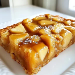 Here’s what you need to make Salted Caramel Apple Bars: - 1 cup unsalted butter - 3/4 cup granulated sugar - 3/4 cup packed brown sugar - 2 large eggs - 2 teaspoons vanilla extract - 2 cups all-purpose flour - 1 teaspoon baking powder - 1/2 teaspoon baking soda - 1/4 teaspoon salt - 2 cups peeled, cored, and diced apples (around 2 medium apples) - 1/2 teaspoon ground cinnamon - 1 cup caramel sauce (store-bought or homemade) - Sea salt for finishing Each ingredient plays a key role in making these bars rich and tasty. Butter adds creaminess. Granulated and brown sugars bring sweetness and depth. Eggs help bind the mix. The vanilla adds a lovely aroma. Flour gives structure, while baking powder and soda provide lift. Salt enhances all the flavors. Apples add moisture and a tart bite, balanced by cinnamon warmth. Finally, caramel and sea salt create that perfect sweet-salty touch. When you gather your ingredients, make sure everything is fresh. This ensures the best flavor. Trust me; it makes a big difference! Keep your apples crisp for a great texture. Use good quality caramel sauce for that rich taste. You can even try making your own if you feel adventurous! {{ingredient_image_2}} Preheating your oven is key. It helps the bars bake evenly. Set your oven to 350°F (175°C). While it heats, prepare a 9x13 inch baking dish. Lightly grease it with butter or line it with parchment paper. Leave some paper hanging over the edges. This makes it easy to lift the bars out later. The next step is creaming the butter and sugars. Use a large mixing bowl. Add the softened butter, granulated sugar, and brown sugar. Use an electric mixer on medium speed. Mix until the mixture is light and fluffy. This should take about 3 to 4 minutes. The air you add helps the bars rise well. Now it’s time to add eggs and vanilla. Add the two eggs one at a time. Make sure to mix well after each egg. This helps the batter stay smooth. After that, pour in the vanilla extract. Mix until everything blends together nicely. For the dry ingredients, grab another bowl. Whisk together all-purpose flour, baking powder, baking soda, and salt. Gradually add this dry mix to the wet ingredients. Use low speed on your mixer. Mix until just combined. Be careful not to overmix. This keeps your bars tender. Next, prepare the apples. In a small bowl, mix diced apples with ground cinnamon. Toss them gently until they are fully coated. This adds a warm flavor. Then, fold the cinnamon-coated apples into the batter. Use a spatula and do this carefully. You want them mixed in without breaking them down too much. Now it’s time to combine everything. Pour the apple-filled batter into the prepared baking dish. Use a spatula to spread it evenly. Then, drizzle the caramel sauce over the top. Use a knife or skewer to swirl the caramel into the batter. Be gentle to keep the apple pieces intact. Place the dish in your preheated oven. Bake for 25 to 30 minutes. To check if they are done, insert a toothpick in the center. It should come out clean or with a few moist crumbs. To make your salted caramel apple bars just right, start with room temperature butter. Cold butter can cause uneven mixing. Mix the butter and sugars until light and fluffy. This step adds air, making the bars soft. To avoid dry bars, do not overmix the batter once you add the flour. Mix until just combined. This keeps them tender and moist. You can boost the flavor with spices. Consider adding nutmeg or ginger for warmth. Adjust sweetness by using less sugar or a sweeter caramel. Taste the batter before baking. You want a balance of sweet and tart from the apples. Serve the bars on a pretty platter or wooden board. Drizzle more caramel sauce on top for a sweet touch. Add thin apple slices on the side for color. A sprinkle of sea salt will enhance the caramel flavor. Pro Tips Use Fresh Apples: For the best flavor and texture, opt for fresh, crisp apples like Granny Smith or Honeycrisp. Their tartness balances perfectly with the sweetness of the caramel. Don't Overmix the Batter: Mix the batter just until the dry ingredients are incorporated to ensure a tender, cake-like texture. Overmixing can lead to dense bars. Chill the Caramel: If using homemade caramel, allow it to cool slightly before swirling. This makes it easier to achieve a marbled effect without it sinking into the batter. Serve Warm: For the ultimate indulgence, serve the bars warm with a scoop of vanilla ice cream on top, drizzled with extra caramel sauce. {{image_4}} You can switch apples for other fruits. Pears work well and add a soft touch. You might also use peaches or berries for a different flavor. Seasonal fruits like cherries or plums can bring fun colors and tastes to your bars. If you need gluten-free options, use almond flour or oat flour. Both work great in this recipe. For vegan substitutions, replace eggs with flaxseed meal mixed with water. You can also use coconut oil or vegan butter instead of regular butter. To add a nutty crunch, mix in chopped walnuts or pecans. You can also fold in chocolate chips for a sweet twist. Different types of caramel sauce can change the taste, too. Try dark caramel for a richer flavor or sea salt caramel for extra zing. To keep your salted caramel apple bars fresh, store them in a cool place. Use an airtight container to protect them from air and moisture. Place parchment paper between layers if you stack them. This will keep the bars from sticking together. For best results, refrigerate the bars if you plan to keep them for more than a few days. The cool temperature will help maintain their texture and flavor. To freeze the bars, first let them cool completely. Cut them into squares as you normally would. Wrap each square in plastic wrap tightly. Then, place the wrapped bars in a freezer-safe bag. This prevents freezer burn and keeps them fresh. To thaw, simply take the bars out of the freezer. Leave them at room temperature for about an hour. For a warm treat, you can microwave them for a few seconds. Enjoy the rich taste of salted caramel apple bars whenever you want! Salted Caramel Apple Bars can last for about 4 to 5 days. Keep them in an airtight container at room temperature. If you want them to last longer, store them in the fridge. Just let them come to room temp before serving. Yes, you can make these bars in advance. Bake them and let them cool completely. Once cool, store them in an airtight container. They taste great even after a day or two. If you don’t have apples, you can use pears or peaches. Both fruits will add a nice flavor. Just make sure they are ripe for the best taste. To make the bars less sweet, reduce the sugar slightly. You can use less brown sugar or granulated sugar. You can also use unsweetened applesauce for extra moisture without adding too much sweetness. Yes, you can use a different size pan. Just keep an eye on the baking time. A smaller pan will take longer, while a larger pan will bake faster. Adjust the time based on how thick the batter is. If the bars are too sticky, let them cool longer before slicing. Use a sharp knife to cut them. You can also dust the knife with flour to help it glide through the sticky parts. In this blog post, we explored the delicious recipe for Salted Caramel Apple Bars. We covered essential ingredients and detailed steps to create the perfect treat. I shared tips for texture and flavor, along with variations to suit your needs. Remember to store your bars properly for freshness. Experiment with different fruits and dietary options to make it your own. Enjoy baking these bars and delight in the taste of fall!