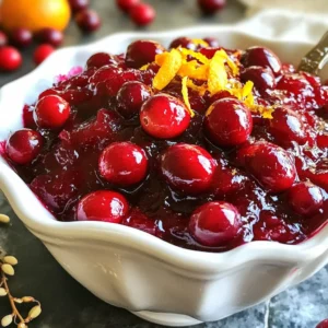 To make a delicious Honey Bourbon Cranberry Sauce, you will need the following ingredients: - 12 oz fresh cranberries, rinsed and sorted - 3/4 cup honey, preferably local - 1/2 cup freshly squeezed orange juice - 1 tablespoon zest from an orange - 1/4 cup water - 1 teaspoon ground cinnamon - 1/4 teaspoon cayenne pepper (adjust to taste for heat level) - 1/4 teaspoon salt - 1 teaspoon pure vanilla extract These ingredients work together to create a sweet and spicy sauce. The fresh cranberries give a nice tartness. Honey adds natural sweetness, while orange juice and zest bring a bright flavor. Ground cinnamon and cayenne pepper add warmth and depth. Each element enhances the others, creating a perfect balance. Using local honey supports your community and can offer unique flavors. Fresh orange juice is best for taste. If you want to spice it up, adjust the cayenne pepper to your liking. This sauce is more than just a side; it’s a tasty delight that pairs well with many dishes. {{ingredient_image_2}} - First, rinse 12 oz of fresh cranberries in cold water. - Sort through them and remove any that are soft or shriveled. - Next, juice two fresh oranges until you have 1/2 cup of juice. - Don’t forget to zest one of the oranges for added flavor! - Place a medium saucepan over medium heat. - Add the rinsed cranberries, honey, orange juice, and 1/4 cup water. - Sprinkle in 1/4 teaspoon of salt and stir the mixture gently. - Increase the heat slightly until it starts to simmer. - Let it bubble gently for 5-7 minutes. The cranberries will burst and create a tangy base. - Once the cranberries pop, stir in the orange zest, 1 teaspoon of ground cinnamon, and 1/4 teaspoon of cayenne pepper. - Add 1 teaspoon of pure vanilla extract and mix well. - Keep simmering for another 5-10 minutes. Stir often to avoid sticking. The sauce should thicken to your liking. - Remove the saucepan from heat and let the sauce cool at room temperature. - Allowing it to cool will enhance the flavor and richness. - Remember, the sauce thickens more as it cools. To know when the sauce is thick enough, look for a rich, glossy finish. The sauce should coat the back of a spoon. If you desire a thicker sauce, simmer it longer. Each simmer will deepen the flavor. You can adjust for personal taste by adding more honey for sweetness or more cayenne for heat. Remember, the sauce will thicken as it cools, so don’t worry if it seems thin at first. Garnish your sauce for a stunning look. A sprinkle of orange zest adds color and boosts flavor. Whole cranberries on top create a festive touch. Serve the sauce in a decorative bowl to impress your guests. A clear glass vessel highlights the vibrant color. This visual appeal enhances the dining experience. This sauce pairs well with roasted turkey and chicken. It also complements savory dishes like pork and duck. Use it as a spread on sandwiches or scones for a tasty twist. If you have leftovers, stir it into yogurt or oatmeal for breakfast. You can even mix it into cocktails for a sweet and spicy kick. Pro Tips Use Fresh Ingredients: Always opt for fresh cranberries and freshly squeezed orange juice to enhance the flavor of your sauce. Adjust the Spice Level: Feel free to modify the amount of cayenne pepper to suit your taste; start with a pinch and add more if desired. Thickening Tips: If the sauce doesn't thicken to your liking, simmer it a little longer, stirring frequently to avoid burning. Flavor Development: For the best flavor, make the sauce a day in advance and let it chill in the fridge overnight; the flavors will meld beautifully. {{image_4}} You can switch honey for maple syrup or agave nectar. Both add a unique taste. Maple syrup gives a rich, earthy flavor. Agave nectar is lighter and sweeter. Adjust the amount based on your preference. Want a milder sauce? Use less cayenne pepper. Start with just a pinch. For more heat, add more cayenne. Taste as you go to find your ideal level. You can also try adding fresh ginger for a different kick. Try adding apple or pomegranate juice for a twist. Apple juice makes it sweeter and lighter. Pomegranate juice adds a deeper, tangy flavor. Mix and match juices for fun new tastes. Experimenting with flavors keeps the sauce fresh and exciting. To keep your Honey Bourbon Cranberry Sauce fresh, use these tips: - Refrigerating: Let the sauce cool completely. Place it in an airtight container. Store it in the fridge. This keeps it safe and tasty. - Freezing: If you want to freeze it, use freezer-safe containers. Leave some space at the top. The sauce will expand as it freezes. It can last up to three months in the freezer. In the fridge, Honey Bourbon Cranberry Sauce lasts about one week. If you freeze it, it can last three months. Always check for any signs of spoilage before using. When it's time to enjoy your sauce again, here are the best ways to reheat it: - Stovetop: Pour the sauce into a saucepan. Heat it over low to medium heat. Stir it often to avoid burning. - Microwave: Place the sauce in a microwave-safe bowl. Heat in short bursts of 20-30 seconds. Stir in between to ensure even heating. These methods keep the flavors intact and the sauce smooth. Enjoy your delightful Honey Bourbon Cranberry Sauce! Yes, you can make Honey Bourbon Cranberry Sauce ahead of time. This sauce tastes even better after a day in the fridge. Make it up to three days before your holiday meal. Just store it in an airtight container. When ready to serve, you can warm it gently or enjoy it cold. Honey Bourbon Cranberry Sauce pairs well with many dishes. Here are some great options: - Roasted turkey or chicken - Ham - Stuffing - Cheese boards - Scones or biscuits This sauce adds a sweet and spicy touch to any plate. You can easily change the sweetness or spice. To make it sweeter, add more honey. Just a tablespoon at a time works well. For spice, adjust the cayenne pepper. Start with less if you want mild heat. Taste as you go to find your perfect balance. This blog post covered how to make Honey Bourbon Cranberry Sauce. We explored the key ingredients, simple steps, and helpful tips to enhance flavor and presentation. I shared variations, storage info, and answers to common questions. This sauce can lift any dish and customize it to fit your taste. Enjoy making it your own, and never hesitate to experiment! Happy cooking!