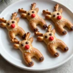 To make Reindeer Pretzel Bites, you need some simple ingredients. Here’s what you’ll need: - 1 cup warm water (between 110°F and 115°F) - 2 tablespoons brown sugar - 1 packet (0.25 ounces) active dry yeast - 2 cups all-purpose flour - 1 teaspoon salt - ¼ cup baking soda - 1 egg, beaten (for egg wash) - Coarse sea salt for garnish - ½ cup chocolate chips (for antlers and eyes) - ½ cup red candy melts (for Rudolph's nose) - ½ cup pretzel sticks (for antlers) Each ingredient plays a key role in making your pretzel bites tasty and fun. The warm water activates the yeast, helping the dough rise. Brown sugar adds a touch of sweetness and helps the yeast work better. All-purpose flour gives the pretzels their structure. Salt enhances the flavor, while baking soda helps create that golden brown color. The egg wash gives the pretzels a nice shine after baking. Coarse sea salt adds a bit of crunch on top. Chocolate chips and red candy melts turn your pretzel bites into adorable reindeer. Finally, pretzel sticks act as antlers, making them look festive and fun. Gather these ingredients, and you are set to create a delightful holiday treat! {{ingredient_image_2}} First, grab a large mixing bowl. Pour in 1 cup of warm water. Make sure it is between 110°F and 115°F. Then, add 2 tablespoons of brown sugar. Mix them well. Next, sprinkle 1 packet of active dry yeast on top. Let it sit for about 5 minutes. You will see bubbles forming. This means your yeast is ready to go! Now it’s time to make the dough. Add 2 cups of all-purpose flour to the yeast mix. Also, add 1 teaspoon of salt. Stir until a dough forms. Then, transfer the dough to a floured surface. Knead it for about 5 minutes. You want it smooth and elastic. Place your dough in a lightly greased bowl. Cover it with a damp cloth. Let it rise in a warm place for about 1 hour. The dough should double in size. You can tell it’s ready when it looks puffed and fluffy. After the dough has risen, punch it down to release air. Divide the dough into small balls, like golf balls. Roll each ball into a long log. Twist it into the classic pretzel shape. This part is fun and creative! Next, prepare to boil the pretzels. In a medium pot, bring 4 cups of water to a gentle boil. Stir in ¼ cup of baking soda. Carefully drop each pretzel into the boiling water. Let them cook for about 30 seconds. Use a slotted spoon to remove them and place on a baking sheet. Now, let’s make them shine! Brush each pretzel with a beaten egg. This gives them a beautiful golden color. Sprinkle coarse sea salt on top for flavor. Preheat your oven to 400°F (200°C) while you prepare. While the pretzels bake, melt ½ cup of chocolate chips in the microwave. Do this in short bursts, stirring every 30 seconds. In another bowl, melt ½ cup of red candy melts the same way. Once the pretzels cool slightly, use pretzel sticks for antlers. Attach chocolate chips for eyes and a red candy melt for Rudolph's nose. Enjoy your festive treat! Boiling the pretzels is key. It gives them that nice, chewy bite. The baking soda in the water helps the crust turn golden and crisp. Look for a deep golden brown color when baking. This shows they are done and ready to eat. Involve kids in making these fun treats! They can help roll the dough and twist it into shapes. Let them decorate, too. Use simple tasks for younger kids, like adding salt or chocolate chips. This makes cooking fun and easy for everyone. Serve your Reindeer Pretzel Bites on a festive platter. Add sparkly decorations to make it special. For a fun touch, include small bowls of warm chocolate sauce for dipping. This makes the treat look great and taste even better! Pro Tips Use Warm Water: Ensure the water temperature is between 110°F and 115°F to properly activate the yeast for a good rise. Knead Thoroughly: Knead the dough for at least 5 minutes to develop gluten, which gives the pretzels their chewy texture. Boil Before Baking: Boiling the pretzels in a baking soda solution before baking creates a beautiful crust and enhances the flavor. Decoration Timing: Decorate the pretzels with melted chocolate and candy melts while they’re still slightly warm for better adhesion. {{image_4}} You can change the fun of Reindeer Pretzel Bites by using different chocolate types. Try white chocolate for a snowy look. Dark chocolate adds a rich taste. Each type gives a new twist on the classic. You can also add sprinkles or coconut on top for fun colors and textures. Sprinkles bring joy to kids, while coconut adds a tropical feel. Think about seasoning your pretzels differently. Instead of coarse sea salt, try garlic powder or cinnamon sugar. These flavors can make your pretzels stand out. You can create sweet or savory variations. Sweet pretzels pair well with caramel, while savory ones go great with cheese dips. You can adapt your pretzel bites for different festive occasions. Try making them for birthdays or Halloween. Change the colors of the chocolate to match the theme. You can also create different animal shapes. Use cookie cutters to make bunnies or stars for spring or summer events. To keep your Reindeer Pretzel Bites fresh, store them in an airtight container. This helps prevent them from drying out. You can use a plastic or glass container with a tight seal. If you have leftover pretzels, let them cool first. Then, place them in the container. To reheat pretzels, the best method is the oven. Preheat your oven to 350°F (175°C). Place pretzels on a baking sheet and heat for about 5-7 minutes. This method keeps them crisp. You can also use a microwave, but be careful. Microwaving too long can make them soggy. If you choose the microwave, wrap each pretzel in a damp paper towel. Heat for 10-15 seconds at a time. To freeze your Reindeer Pretzel Bites, let them cool completely. Then, place them in a freezer-safe bag. Remove as much air as possible. You can freeze them for up to three months. When you are ready to eat, take them out and thaw overnight in the fridge. Reheat them in the oven or microwave as described above. This keeps them tasty and fun! Reindeer Pretzel Bites can last up to 2 days at room temperature. Keep them wrapped in plastic or in an airtight container. If you store them in the fridge, they can last for about 5 days. Just remember to bring them to room temperature before enjoying! Yes, you can make the dough ahead of time. Just mix it, let it rise, and then store it in the fridge. This will slow down the rising process. When you’re ready to bake, let it come to room temp. The texture may change a bit, but it will still taste great! If you don't have baking soda, you can use baking powder. Use about three times the amount of baking powder. Keep in mind, this may change the taste and texture slightly. Baking soda gives the pretzels that nice chewy bite. You can make gluten-free Reindeer Pretzel Bites! Use a gluten-free flour blend. Look for blends that include xanthan gum for better texture. Almond flour or coconut flour can work too, but may change the taste. Experiment to find what you like best! In this post, we explored how to make fun reindeer pretzels using simple ingredients. We went through each step, from activating the yeast to decorating cute shapes. Remember, the key to great pretzels is in the boiling and baking. Don't hesitate to get kids involved in this fun project and personalize your treats. Finally, keep leftovers fresh with proper storage and feel free to experiment with flavors! Your festive treats will surely delight everyone. Enjoy this tasty activity during your holiday celebrations!