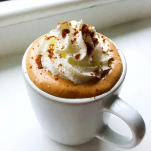 To make a tasty Pumpkin Spice Eggnog, you need these main ingredients: - 2 cups whole milk - 1 cup heavy cream - 3/4 cup pumpkin puree - 1/2 cup granulated sugar - 4 large egg yolks - 1 teaspoon vanilla extract - 1 teaspoon ground cinnamon - 1/2 teaspoon ground nutmeg - 1/4 teaspoon ground ginger These items create a rich and creamy base. The pumpkin puree gives it that warm fall flavor. The spices add depth, making each sip delightful. You can also try these optional ingredients to mix things up: - Almond milk (for a lighter version) - Coconut milk (for a tropical twist) - Maple syrup (as a natural sweetener) - Whipped topping (for extra creaminess) Using these substitutes can change the taste. They can also suit different dietary needs. To make your eggnog look and taste even better, consider these garnishes: - Whipped cream (for a fluffy top) - Ground cinnamon (for a spicy finish) - Nutmeg (for a classic touch) - Crushed graham crackers (for a crunchy texture) These toppings add a nice touch. They can make your drink festive and fun! {{ingredient_image_2}} To make pumpkin spice eggnog, start by warming 2 cups of whole milk and 1 cup of heavy cream in a medium saucepan. Heat it on medium until it&rsquo;s warm, about 150&deg;F. Stir it gently, but do not let it boil. In a separate bowl, mix 3/4 cup of pumpkin puree, 1/2 cup of granulated sugar, and 4 large egg yolks. Add 1 teaspoon of vanilla extract, 1 teaspoon of ground cinnamon, 1/2 teaspoon of ground nutmeg, and 1/4 teaspoon of ground ginger. Whisk these ingredients until smooth. Next, slowly pour the warm milk and cream into the pumpkin mix while whisking. This helps the eggs warm up without curdling. Once combined, pour the mixture back into the saucepan. Cook it over low heat, stirring constantly for about 5-7 minutes. You want it to thicken enough to coat the back of a spoon. Avoid boiling it, as this can ruin the texture. Make sure to heat the milk and cream slowly. If it gets too hot, it can boil, which is not good. When mixing the warm liquid with the egg mixture, whisk continuously. This step is key to prevent the eggs from cooking too fast and turning into scrambled eggs. Keep stirring while cooking on low heat. This helps the eggnog thicken evenly. If you stop stirring, it can stick to the bottom of the pan and burn. After thickening, take the saucepan off the heat and let the eggnog cool for about 15 minutes at room temperature. Then, strain it through a fine-mesh sieve into a bowl or pitcher. This step ensures a smooth drink by removing lumps. Chill the strained eggnog in the fridge for at least 2-3 hours. Once it&rsquo;s fully cold, serve it in festive glasses. Top each serving with whipped cream and a sprinkle of ground cinnamon for a lovely finish. Enjoy the delicious, spiced flavor! To get a silky smooth pumpkin spice eggnog, use these tips: - Heat slowly: Warm the milk and cream gently. Stir often to prevent scorching. - Whisk well: Blend the pumpkin puree and egg yolks until creamy. This mixes air in. - Temper the eggs: Pour warm milk into the pumpkin mix slowly while whisking. This keeps the eggs from cooking too fast. Here are a few common hiccups to avoid: - Do not boil: Boiling the mixture can turn it grainy. Keep the heat low and steady. - Watch the time: Stir the mixture constantly while it thickens. This takes about 5-7 minutes. - Strain carefully: Use a fine-mesh sieve to catch lumps. This step is key for smoothness. You can make this eggnog your own by adjusting flavors: - Sweetness: Start with 1/2 cup of sugar. Taste it, and add more if you like. - Spices: For more warmth, add extra cinnamon or nutmeg. Start with 1/4 teaspoon more. - Pumpkin puree: For a stronger pumpkin flavor, increase the puree to 1 cup. Feel free to play around with these ideas to make your perfect pumpkin spice eggnog! Pro Tips Use Fresh Pumpkin Puree: For the best flavor, opt for homemade pumpkin puree instead of canned. It enhances the taste and freshness of your eggnog. Whisk Constantly: When combining the warm milk with the egg mixture, whisk continuously to prevent the eggs from curdling. This ensures a smooth and creamy texture. Chill Thoroughly: Allow the eggnog to chill in the fridge for at least 2-3 hours. This not only improves the flavor but also ensures it&rsquo;s refreshing when served. Garnish Creatively: Elevate your presentation by garnishing with whipped cream and a sprinkle of ground cinnamon or even a cinnamon stick for added flair. {{image_4}} You can easily make a dairy-free version of pumpkin spice eggnog. Use almond milk or coconut milk instead of whole milk. For creaminess, opt for canned coconut cream. Replace egg yolks with silken tofu or a banana. This keeps the rich texture. Sweeten it with maple syrup or agave nectar. Add your spices for flavor, and enjoy a vegan treat. If you want to add a kick, try spiking your eggnog. Rum or bourbon works well here. Add about 1 cup of your chosen spirit to the mix. This gives the drink a warm, cozy vibe. You can also try flavored liqueurs like butterscotch. This adds a new taste dimension. Just remember to adjust sweetness as needed. Feel free to get creative with flavors! For a chocolate twist, mix in chocolate syrup or cocoa powder. Start with 1 to 2 tablespoons. If you prefer caramel, drizzle some caramel sauce into the mix. This adds sweetness and a rich flavor. You can also blend in a pinch of espresso powder for a coffee kick. Each of these options makes your eggnog unique and fun! To store leftover Pumpkin Spice Eggnog, you need a clean, sealed container. A glass jar or a plastic pitcher works well. Pour the eggnog into the container and close it tightly. Place it in the fridge. This keeps the eggnog fresh and safe to drink. You can freeze Pumpkin Spice Eggnog, but it may change texture. To freeze, pour eggnog into freezer-safe bags. Leave some space for expansion. When ready to use, thaw the eggnog in the fridge overnight. Stir well before serving, as it may separate. Pumpkin Spice Eggnog lasts about 3-5 days in the fridge. If you freeze it, it can last up to 3 months. Always check for any off smell or changes in texture before drinking. If you see any signs of spoilage, it's best to toss it out. Enjoy your eggnog safely! Eggnog has a long history. It dates back to the 14th century. Early forms included milk, eggs, and alcohol. This drink was popular among the rich. It often appeared at holiday feasts. The name &ldquo;eggnog&rdquo; likely comes from two words: &ldquo;egg&rdquo; and &ldquo;noggin,&rdquo; a small cup. Over time, it became a holiday favorite for many. Yes, you can use pumpkin pie spice. It combines cinnamon, nutmeg, and ginger. This makes it easy to add flavor. Use about 2 teaspoons of pumpkin pie spice. Adjust based on your taste. It simplifies the recipe while keeping it tasty. You can make Pumpkin Spice Eggnog a day ahead. Follow the recipe and chill it. Store it in a pitcher in the fridge. This allows the flavors to blend well. Just remember to stir before serving. Garnish with whipped cream and cinnamon. Enjoy it cold and festive! This blog post covered how to make Pumpkin Spice Eggnog using key ingredients and steps. You learned about optional elements and garnishes that can enhance your drink. I shared tips for smooth texture and customization. We explored variations, including dairy-free options and flavor boosts. Lastly, I provided storage information to keep your eggnog fresh. Enjoying your homemade eggnog can be a festive treat. Follow these steps to impress your friends and family!