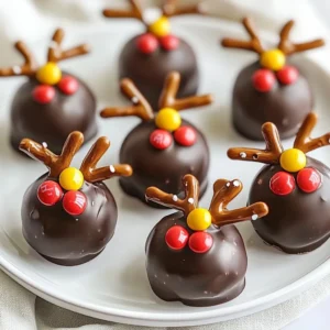 To make No-Bake Christmas Reindeer Treats, you need: - 2 cups chocolate sandwich cookies, finely crushed - 1 cup creamy peanut butter - &frac12; cup powdered sugar - 1 cup chocolate chips (for melting) - 16 pretzel twists (for antlers) - 16 candy eyes - 16 red M&M&rsquo;s (for noses) - 1 tablespoon vegetable oil (for melting chocolate) If you need to convert measurements, here&rsquo;s a quick guide: - 1 cup = 8 fluid ounces - &frac12; cup = 4 fluid ounces - 2 cups = 16 fluid ounces - 1 tablespoon = 3 teaspoons You can swap some ingredients based on your taste: - Use almond butter instead of peanut butter for a nutty twist. - Try using gluten-free cookies for a gluten-free option. - Dark chocolate chips work well if you prefer a richer taste. - Mini pretzels can replace pretzel twists for a different look. These options allow you to customize your treats while keeping the fun and festive spirit alive! {{ingredient_image_2}} Start by gathering all your ingredients. You will need chocolate sandwich cookies, peanut butter, and powdered sugar. Also, have your chocolate chips, pretzels, candy eyes, red M&Ms, and vegetable oil ready. This will help keep things organized. In a large mixing bowl, combine the crushed chocolate sandwich cookies, peanut butter, and powdered sugar. Use a spatula or your hands to mix until it forms a dough. It should feel sticky but hold together well. Once mixed, scoop out a tablespoon of the dough. Roll it into a ball about 1-inch wide. Repeat this until you shape all the dough into 16 balls. Place the cookie balls on a baking sheet lined with parchment paper. Chill them in the fridge for about 30 minutes. This helps them firm up. While they chill, melt the chocolate. In a microwave-safe bowl, mix chocolate chips and vegetable oil. Microwave for 30 seconds at a time, stirring after each interval. Once smooth, remove the cookie balls from the fridge. Dip each ball into the melted chocolate, ensuring it is fully coated. Then, place them back on the parchment paper. Quickly add pretzel twists for antlers before the chocolate hardens. Press two candy eyes and a red M&M on each ball for faces. Let the chocolate set at room temperature or chill briefly to firm up. To get a smooth chocolate coat, use good quality chocolate chips. I mix in a bit of vegetable oil. This keeps the chocolate shiny and easy to spread. Melt the chips in short bursts in the microwave. Stir often to avoid burning. After dipping, let excess chocolate drip off before setting the treats down. When you place the pretzel twists, do it while the chocolate is still wet. This helps them stick well. For the eyes and noses, use a gentle push. It helps them stay in place. You can use mini chocolate chips if you can't find candy eyes. The red M&M adds a nice pop of color. These reindeer treats look great on a festive platter. You can add sprinkles for extra flair. Try using green and red sprinkles to match the holiday theme. These treats are perfect for parties or as gifts. Just pack them in a cute box. They will brighten anyone's day! Pro Tips Chill for Better Coating: Make sure to chill the cookie balls for at least 30 minutes. This helps them hold their shape better when you dip them in chocolate. Choose Quality Chocolate: Use high-quality chocolate chips for melting to ensure a smooth and delicious coating. Customize Your Antlers: Get creative with your antlers! You can use different types of pretzels or even chocolate-covered pretzels for a fun twist. Let the Chocolate Set: Allow the chocolate to set at room temperature for the best texture. If you're in a hurry, you can place them in the fridge for a quick firming process. {{image_4}} You can change the flavor of these treats easily. Try using vanilla cookies for a lighter taste. You can also swap peanut butter for almond butter. This gives a nutty twist that pairs well with chocolate. For a minty version, add mint extract to the melted chocolate. Just a few drops will do! If you have allergies, there are great swaps. Use sunflower seed butter instead of peanut butter for nut-free treats. For a gluten-free option, choose gluten-free cookies. You can find many brands that taste just as good. If you want a vegan treat, use dairy-free chocolate chips and nut butter. Make your reindeer treats even more fun with decorations. Use mini marshmallows instead of candy eyes for a fluffy look. You can also add colorful sprinkles for a festive touch. Try using different colored M&M&rsquo;s for a unique nose. Let your kids help with the decorating. It&rsquo;s a fun way to celebrate the season! To keep your No-Bake Christmas Reindeer Treats fresh, store them in an airtight container. This will help them stay moist and tasty. I like to use a container that is not too big. It helps prevent the treats from moving around and getting damaged. When stored properly, these treats last about five days at room temperature. If you keep them in the fridge, they can last up to two weeks. Just make sure to check for any changes in texture or smell before eating. You can freeze these treats for longer storage. Simply place them in a single layer on a baking sheet and freeze for about an hour. Once firm, transfer them to an airtight container or freezer bag. They will keep well for up to three months. To enjoy, thaw them in the fridge overnight before serving. Yes, you can make these treats in advance. They stay fresh in the fridge for up to a week. Just store them in an airtight container. If you want to freeze them, wrap each treat in plastic wrap. Then, place them in a freezer bag. They can last for up to three months in the freezer. Just let them thaw in the fridge before serving. To adjust the recipe for different servings, you can easily scale the ingredients. For example, if you want to make 8 treats instead of 16, just halve each ingredient. If you need 32 treats, double the amounts. Keep the ratios the same for the best results. Remember, each treat should still be about 1 inch in size. If you need a peanut butter alternative, try using almond butter or sun butter. Both options provide a similar texture and flavor. Nut-free options are great for people with allergies. You can also use chocolate hazelnut spread, but that will change the taste a bit. Just make sure any substitute is smooth for easy mixing. This blog post covered everything you need to know about making delicious treats. We looked at key ingredients, step-by-step instructions, and helpful tips. I shared ways to add your own spin with flavor and decoration options. Plus, we discussed storage to keep your treats fresh. Remember, cooking is fun! Experiment and enjoy the process. Whether you follow the recipe exactly or make it your own, have fun in the kitchen.